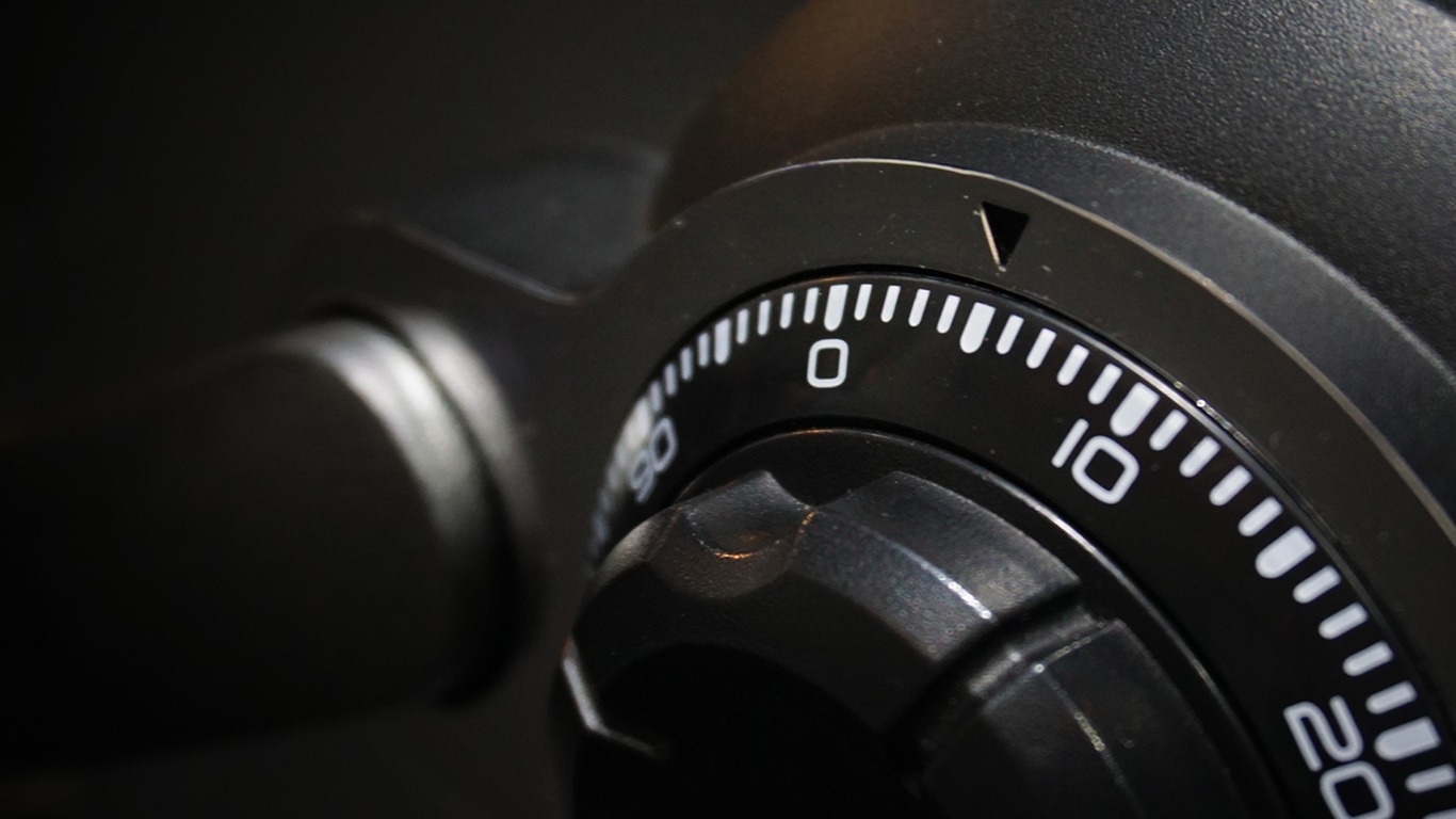 young asian delivery man in blue uniform with parcel cardboard box on isolated
